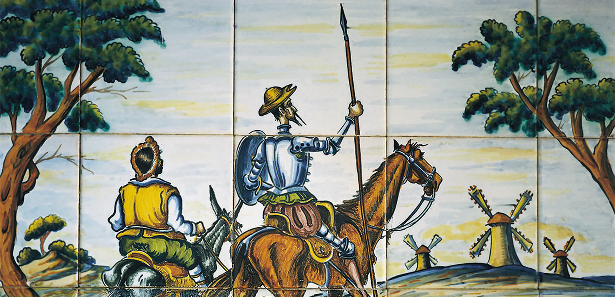 Don Quichot en Sancho Panza voor de windmolens.